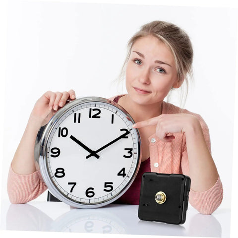 Person holding a round clock next to a Quartz Clock Movement Replacement Battery Operated DIY Repair Kit on a table.