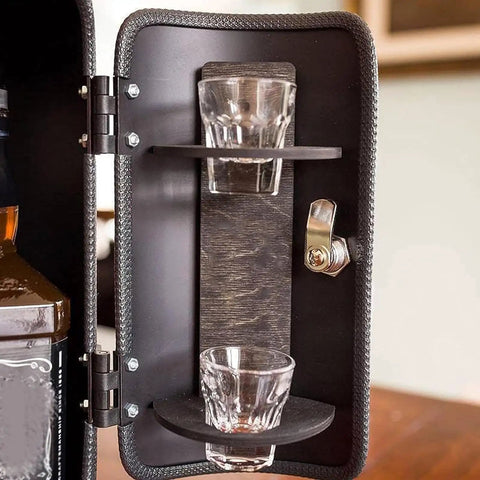 Interior view of Disguised As A Realistic Fire Extinguisher Mini Bar showing shot glasses and bottle holder.