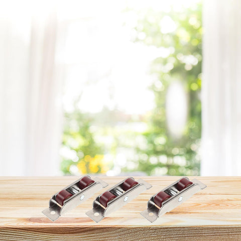 No Sweat Double Wheel Sliding Door Rollers Heavy Duty Stainless Steel Sash Pulleys on wooden surface with blurred background.