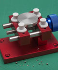 Aluminum Work Holder With Threaded Tightening Screw And Two Sliding Clamps Rock Solid Red Anodized Finish Heavy Duty Workshop Tool For Precise Part Holding And Repair, red aluminum work holder with blue knob