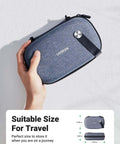 Rugged Hardshell Tech Organizer Travel Case Packs All Your Fresh Gadgets Square With Nifty Double Layer Pouch For Cables Chargers And Memory Cards In Sleek Space Grey held in hand.