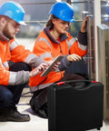 Badass Plastic Tool Box With Rugged Carry Handle Crafted For Weekend Warriors Storing Measuring Tape Levels Screwdrivers Socket Wrenches Repair Essentials Organizer Bin in use on a job site with two workers.