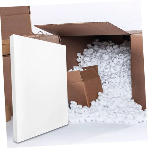 2 Pack High Density PU Foam Sheets Heavy Duty Cuttable Packing Pads beside cardboard boxes filled with packing peanuts.