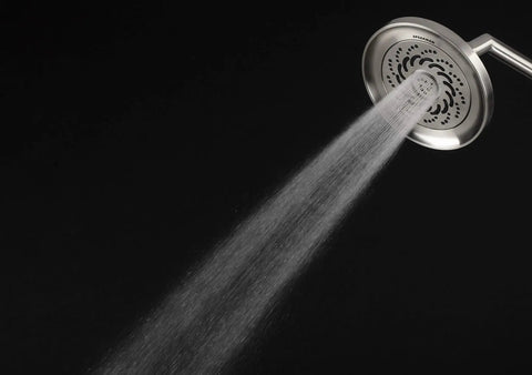 Kubos Exhilaration High Pressure Handheld Shower Head Matte Black Finish demonstrating strong water spray pattern against black backdrop.