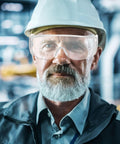Killer Safety Glasses With Side Shields For Labs Shops And Daily Grinding Lightweight wraparound eye protection worn by an older man.