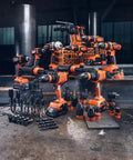 Professional Heavy Duty Compact Four Speed Cordless Drill With Brushless Motor All Metal Transmission QuickIN Adapter and rugged case arranged with various drill bits on a workshop floor.