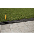 Pro Grade Trench Drain Kit With Black Grate, 9.84 Ft Total Length in lawn and pavement landscape installation view
