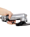 5 Inch Pneumatic Angle Grinder Built Different With Quick Air Hookup And 11000 RPM Power To Handle Your Daily Grind Crushing Steel And Iron Jobs In Any Workshop Or Garage Space, held in hand.