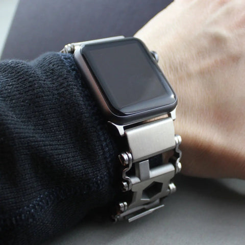 Person wearing Stainless Steel Watch Adapter For Leatherman Bracelet Silver Tread Compatible With Apple Watch Ultra.