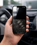 Hand holding phone in car showing half-cleaned screen to illustrate use of 2 Pack Car And Device Screen Cleaner Spray And Wipe 2 In 1 Touchscreen Mist Cleaner For iPhone iPad Laptop MacBook And More With Microfiber Cloth Streak Free Fingerprint Remover Grey And Rose Gold