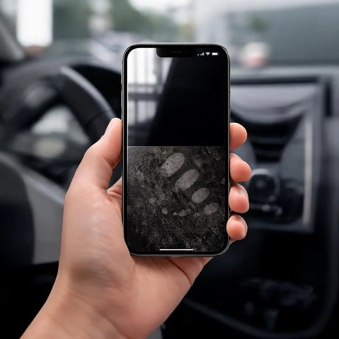 Hand holding phone in car showing half-cleaned screen to illustrate use of 2 Pack Car And Device Screen Cleaner Spray And Wipe 2 In 1 Touchscreen Mist Cleaner For iPhone iPad Laptop MacBook And More With Microfiber Cloth Streak Free Fingerprint Remover Grey And Rose Gold