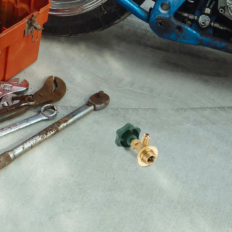 Heavy Duty Car Ac Refrigerant Tank Adapter For Freon Refill Charging Valve Kit with green knob on garage floor.