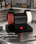 Compact Mini Bench Grinder With Secure Anti Slip Base And Safety Wheel Guards Packs A Pure Copper Motor And Adjustable Speed Settings to sharpen tools on a workbench.