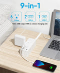 Flat Plug Power Strip With Five Foot Extension Cord Giving Six Wide Spaced AC Outlets Plus Three USB Charging Ports Including One Fast Type C on a desk.