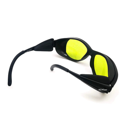 Heavy Duty Laser Safety Goggles Lock Down Eye Protection From UV IR And Blue Light Across 190 To 10600 Nanometers, black with yellow lenses.