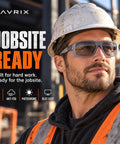 Smooth Transition Z87 Safety Glasses With Hella Clear Photochromic Lenses Anti Fog UV400 Blue Light Blocking For Driving And Work Top Shelf Eye Protection In Slick Gray worn by a man in a hard hat, looking confidently outdoors.