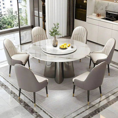 Top Shelf Faux Marble Round Dining Table With Effortless Spin Lazy Susan Turntable Solid Black Metal Pedestal Base For Modern Kitchen Gatherings Accommodates Four Guests Without Extra Chairs, with six chairs and a flower vase.