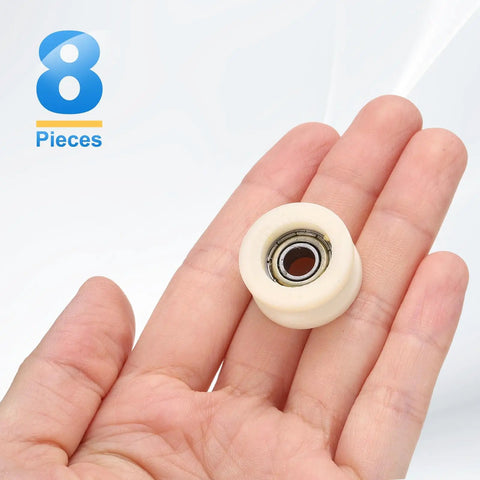 Straight Up Tough Eight Pack U Groove Plastic Guide Bearing Pulley Wheels Designed For Smooth Sliding Doors And Heavy Duty Conveyor Track Automation Hardware held in hand.