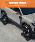 Heavy Duty Car Wheel Dolly Set Of 4, Tough As Nails reinforced steel moving carts supporting a vehicle on black platforms.