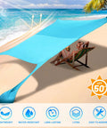 Pop Up Beach Tent Sun Shelter Grande 10x10ft Canopy With 4 Stability Poles on sandy beach with couple relaxing underneath