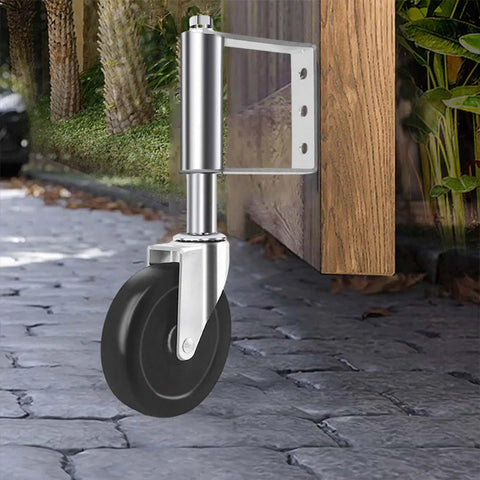 Heavy Duty Spring Loaded Gate Caster Wheel 4 Inch Silver Roller With Smooth Ride Mechanics for Backyard Fence Gates installed on a stone path.