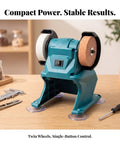 Kickass Compact Bench Grinder Featuring Dual Wheel Sharpening And Polishing Rig With Rugged Suction Base Front Toggle Switch And Versatile White Brown Grinding Discs For Garage Builds on work table.