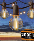 Outdoor String Lights IP65 Waterproof 200 Ft With 104 G40 Bulbs Two Pack 100 Ft Each Dimmable For Patio Porch Backyard Cafe Cozy Vibe Ambience Rain Or Shine, glowing bulbs close-up against a rainy backdrop.
