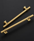 Level Up Your Home With These Slick Gold Cabinet Pulls Packed In A 30 Pack Set With 8 Inch Center To Center Spacing Crafted From Heavy Duty Stainless Steel Perfect For Kitchen Islands And Bathroom Vanity Updates. Two gold cabinet pulls on a black background.