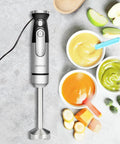 Powerful Handheld Immersion Blender 700W With Infinite Variable Speeds All In One Stainless Steel Stick Mixer next to bowls of puree