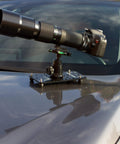 Hassle Free Setup Backpack Ready Low Profile Cheese Plate Mount For Seamless Camera Rigging Compact Flat Tripod Adapter For Dslr Mirrorless Action Cam Creators On The Go mounted on car with DSLR and lens.