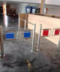 Heavy Duty Swing Safety Gate With Automatic Spring Loaded Lock For Commercial Walkways And Job Sites No Fuss Floor Mount Setup And Rock Solid Everyday Performance in stainless steel frame with colored panels.