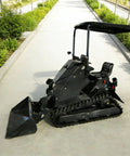 Versatile Mini Crawler Skid Steer Loader With Hydraulic Cylinder on a pathway, showcasing compact build and wear-resistant bucket.