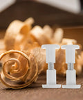 50 White Wood Panel Fasteners And Connector Bolts Kit For Cabinet And Tabletop Assembly with wood shavings background