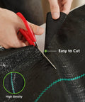 Hands using scissors to cut Heavy Duty Garden Weed Barrier Fabric 3ft By 100ft Landscape Ground Cloth With Superior Permeability
