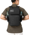 Rugged 25L Military Tactical Backpack For Everyday Carry And Bug Out Readiness With Molle Webbing Laser Cut Panels Dual Cup Holders Compact Daypack Rucksack For Men EDC Gym And Travel Black on man from back view