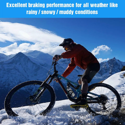 Cyclist riding mountain bike in snow with 25 Pairs Copper Semi-Metallic Mountain Bike Disc Brake Pads For Hydraulic Brakes.