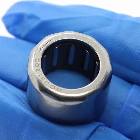 Top Shelf Five Pack One Way Needle Bearing Clutch Release Roller For Smooth Shifting And High RPM Operation Built Tough Heavy Duty Single Needle Roller One Half By Three Quarter By Half Inch Shop Reliable Garage Essential, close-up of needle roller clutch.