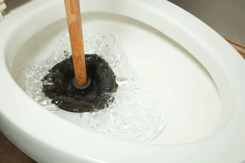 Heavy Duty Rubber Toilet Plunger With Solid Wood Handle And Precision Force Cup Head Boosts Suction To Clear Toilets Sinks And Drains Fast Classic Design That Nixes Stubborn Clogs And Gunk Instantly in action in a toilet bowl.