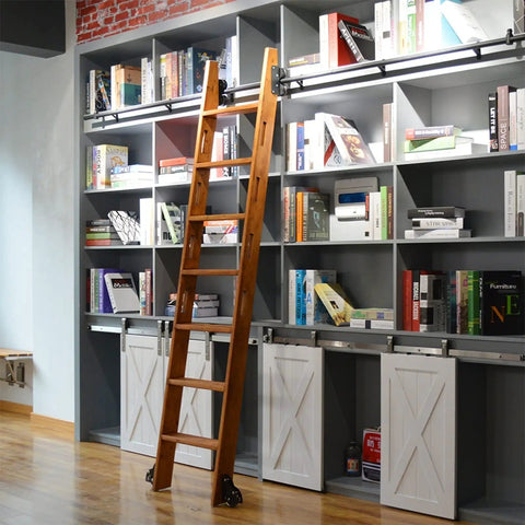 Built Tough Sliding Barn Door Track Kit With Rust Proof Extension Rail And Quiet Floor Roller For Quick Home Or Library Setup Smooth Glide Motion Reliable Structure Handles Three Hundred Thirty Pounds, featuring wooden ladder on gray bookshelves.