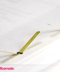 Score Some Top Shelf Brass Plated Paper Fasteners Boasting Razor Sharp Tips And Rock Solid Shanks That Slide Through Stacks Effortlessly A One Hundred Piece Box Handles Daily Paperwork Without Any Drama - Close-up of a brass fastener on paper.