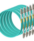 Top Shelf OM3 LC To LC Multimode Fiber Patch Cable Slick Blue Jacket Low Smoke Zero Halogen Build Smooth Network Connections For Server Racks And Data Centers ten pack bundle, showing multiple cables with connectors.