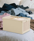 No Stress Foldable Storage Cubes With Heavy Duty Dual Handles For Thick Blankets Linens And Winter Jackets Fast To Flatten And Stack Away Every Single Day on a bed among clothes.