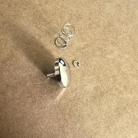 Premium Metal Shutter Replacement Button For Compact Cameras Featuring Smooth Snap Action And A Dead Simple Drop In Install Process For Quick Home Repairs Today Snazzy Look And Reliable Performance, shown with spring and clip.