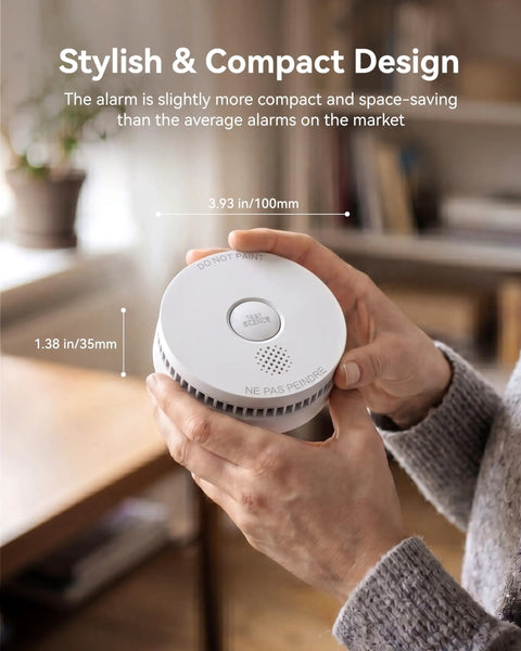 Top Shelf Photoelectric Smoke Detector With 9V Battery Operation And Ultra Sensitive Slow Smoldering Fire Alert in hand for compact design.