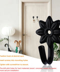 Heavy Duty Retro Flower Wall Hooks Eight Pack Slick Vintage Decorative Hardware Holds Up A Ton installed on wall.