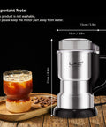 Badass Electric Coffee And Spice Grinder With Hella Fast 150 Watt Motor And Razor Sharp Stainless Blades For Roasted Beans Fine Herbs Plus Mini Kitchen Powder Maker That Crushes Everything In Seconds on wooden table with iced coffee.