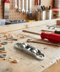 Heavy Duty Sliding Door Rollers With Double Wheel Pulley And Adjustable Balance Wheels on a workbench with tools.