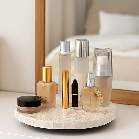 Heavy Duty 12 Inch Turntable With Silky Smooth 360 Spin And Shimmering Mother Of Pearl Detailing On A Luxe Champagne Gold Base For Counters And Vanities That Really Slay holding beauty products on a bathroom vanity.