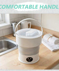 Compact Folding Mini Washing Machine Portable Laundry Basin Road Trip Ready Dorm Staple with handle in kitchen setting.