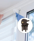 Hella Durable Replacement Clutch Plugs For 1.5 Inch Roller Blinds, showing a brown plug secured on a window frame.